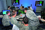 Image of Army students train for the next war using computers instead of rifles. 
