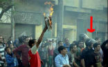 Image of Egyptian police stand in the crowd as Muslims burn a Bible before a Coptic cathedral. What would happen if the roles were reversed?