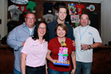 Image of Celebrity judges (back row) Chris Shepherd, owner and executive chef at Underbelly; Seth Payne, former Houston Texans defensive tackle and SportsRadio 610 host; and Neil Doherty, chef at Sysco, selected Bocados as their winner, with owners Lily Hernandez '84 and Terry Flores '86.
 