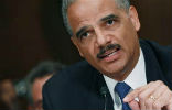 Image of Attorney General Eric Holder vows action against the IRS. 