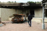 Image of An image of the destruction outside the U.S. embassy in Benghazi.