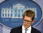 Image of Jay Carney is on the defensive over the IRS scandal. 