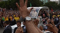 Image of Pope Francis greeting the thousands who gathered upon his arrival in Brazil