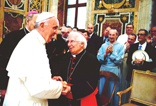 Image of Pope Francis surprises the conference attendees. Dr. Ted Rebard is pictured holding his hat.