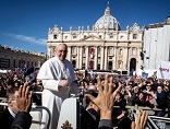 Image of Pope Francis kissing the feet of Jesus, as He reveals Himself in the poor