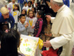 Image of Children helped Pope Francis blow the candles out on his birthday cake. 