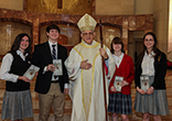 Image of High school essay winners with the Most Rev. Joseph A. Fiorenza, archbishop emeritus of Galveston-Houston.