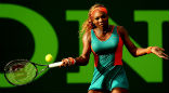 Image of Serena Williams, who owns part of the Miami Dolphins football team, wore an outfit reflecting the teams colors during her match on March 20.