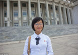 Image of Miss Kim, the guide for French photographer Eric Lafforgue