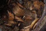 Image of The $11 million worth of gold coins were found in eight cans, buried in a northern California couple's yard.