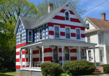 Image of A father of seven foster children painted his house like an American flag after he received nine complains.