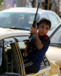 Image of An Iraqi child who has joined the volunteer Shiite militias which are springing up to battle the Sunni Muslim group ISIS.