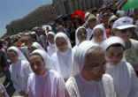 Image of Pope Francis waving during the Angelus address.