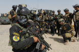 Image of Members of Iraq's military special forces outside Tikrit.