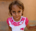 Image of A child of the Yazidi minority group, noted for blonde hair, blue eyes and a fairer complexion.
