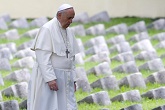 Image of Pope Francis walks inside the Austro-Hungarian cemetery at Fogliano in Redipuglia September 13, 2014. REUTERS/Stefano Rellandini 