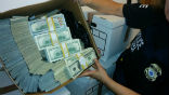 Image of Federal officers seized $100 million from downtown Los Angeles businesses as part of an anti-cartel bust.