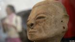 Image of 14th century artifacts from Colombia being displayed in a Spanish museum.