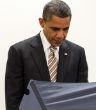 Image of President Obama casting his early vote in Illinois for the 2014 midterm.