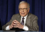 Image of Warren Buffett recently lost $2 billion from investments in Coke and IBM, which have led some to believe that a stock market slowdown might be imminent.