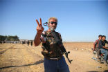 Image of A Kurdish fighter engaged against the Islamic State in the Syrian town of Kobane, near the Turkish border.