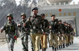 Image of Chinese and Pakistani soldiers conduct a cooperative, joint-border patrol. China has large borders with Russia, Mongolia, Pakistan, India and numerous smaller countries.