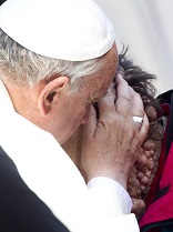 Image of Pope Francis embracing Jesus in the face of the poor