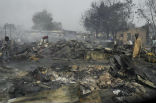 Image of The rubble of a building demolished during an attack by the Islamist group Boko Haram, which has waged a five year insurgency against the Nigerian government.