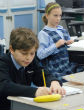 Image of Fourth-grade students work on personalized language arts activities at St. Thomas More Cathedral School in Arlington. (Christine Stoddard, The Arlington Catholic Herald)