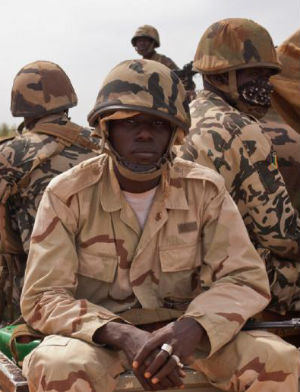 Image of A Mali soldier sits in a truck. Mali has been engaged in a civil war since 2012.