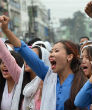 Image of Large groups protest the rape, leading to the creation of the mob.