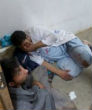 Image of Afghan staff react inside a Medecins Sans Frontieres (MSF) hospital after an air strike in the city of Kunduz, Afghanistan (Reuters).