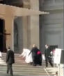 Image of Pope Francis tumbled in front of onlookers. 