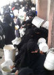 Image of Since ISIS took Raqqa her citizens have suffered greatly. With clean water so scarce, women collect it in buckets to be boiled and cooled at home (Twitter).