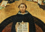 Image of St Thomas Aquinas in prayer before the crucifix. 