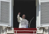 Image of Pope Francis waves to faithful gathered in St. Peter's Square on the
occasion of the Angelus noon prayer at the Vatican.