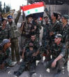 Image of Syrian troops reached Palmyra while Iraqi troops launched an attack against Mosul.