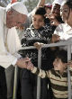 Image of Pope Francis visits Lesbos to speak on behalf of the refugees (Guardian).