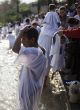 Image of Christian pilgrims often come to get baptized in the same river Jesus was baptized (Alamy Stock Photo).