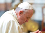 Image of Pope Francis prays for women.