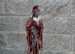 Image of Satanists desecrate a statue of the Virgin Mary.