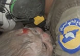 Image of Rescuers save a 30-day-old baby from beneath the rubble of a building (Exclusivepix Media).