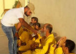 Image of Christians, Muslims and non-believers join together to offer food and water to ISIS militants (Preemptive Love).