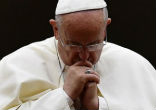 Image of Pope Francis prays for the victims of ISIS cruelty.