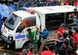 Image of Anti-US protestors were struck with a police van, which then backed up over the crowd to hit them again.