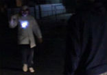 Image of A clown holding a wooden plank approaches teenagers... (Skoosa).