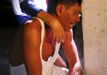 Image of The parents of a 7-year-old victim mourn the loss of their daughter (Reuters).