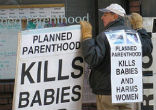 Image of Protesters call for an end to Planned Parenthood.