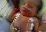 Image of Little Frankie received a miracle (Alex Cousins/SWNS).