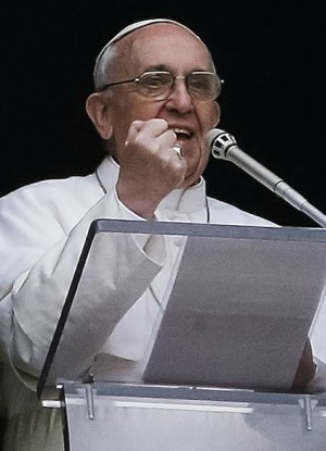 Pope Francis admits he doesn't like to travel but does so anyway to spread hope.